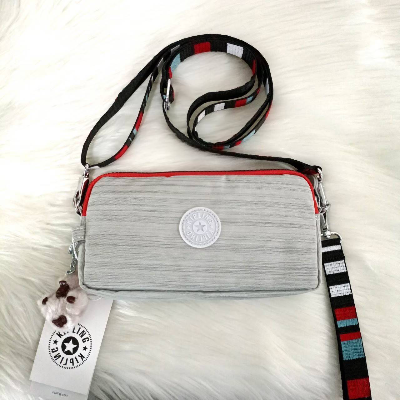 KIPLING กระเป๋าสตางค์ซิปรอบ ใบยาว Seoul up clutch & sling bag