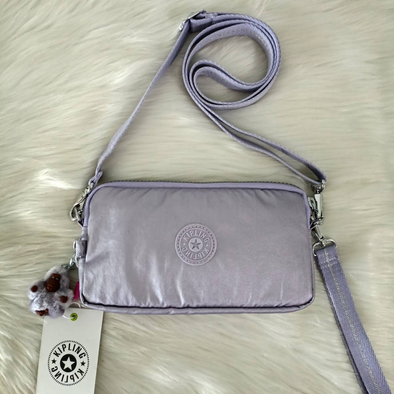 KIPLING กระเป๋าสตางค์ซิปรอบ ใบยาว Seoul up clutch & sling bag