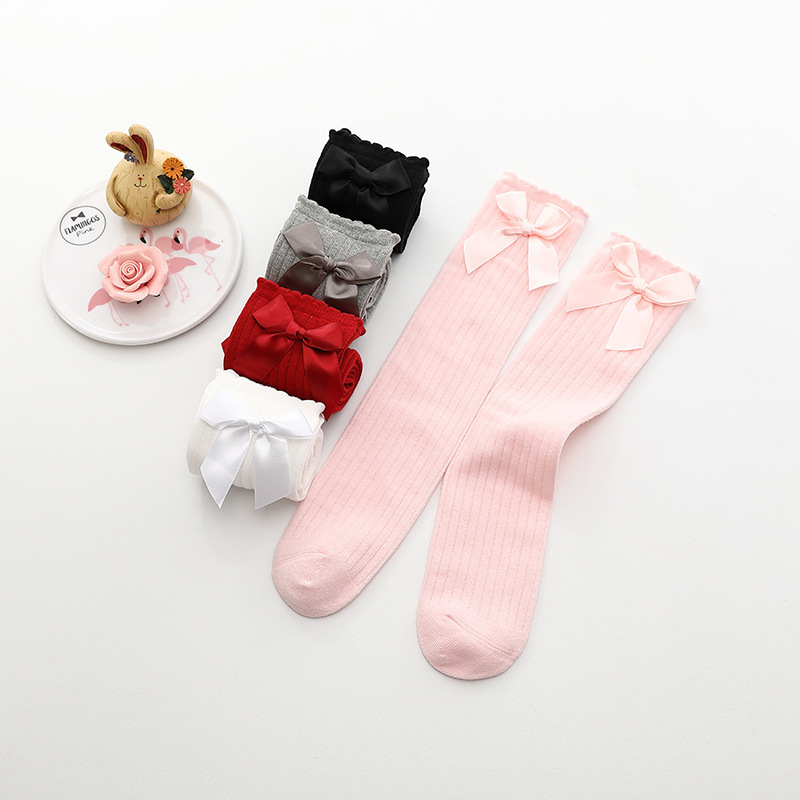 ถุงเท้ายาวเด็กผู้หญิงสีขาว ติดโบว์น่ารัก สไตล์แฟชั่นเกาหลี ขนาดแบบฟรีไซส์ ยาว 36 ซม.