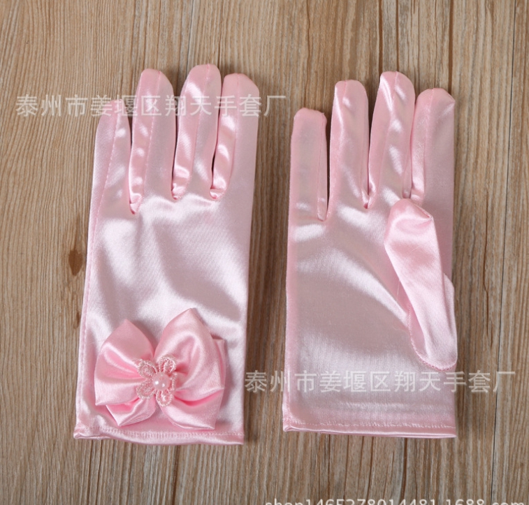 ถุงมือเด็กออกงานสีชมพู หรือใช้ในการแสดง ติดโบว์และมุกน่ารัก ยืดได้ สำหรับเด็กอายุ 8ขวบ ขึ้นไป