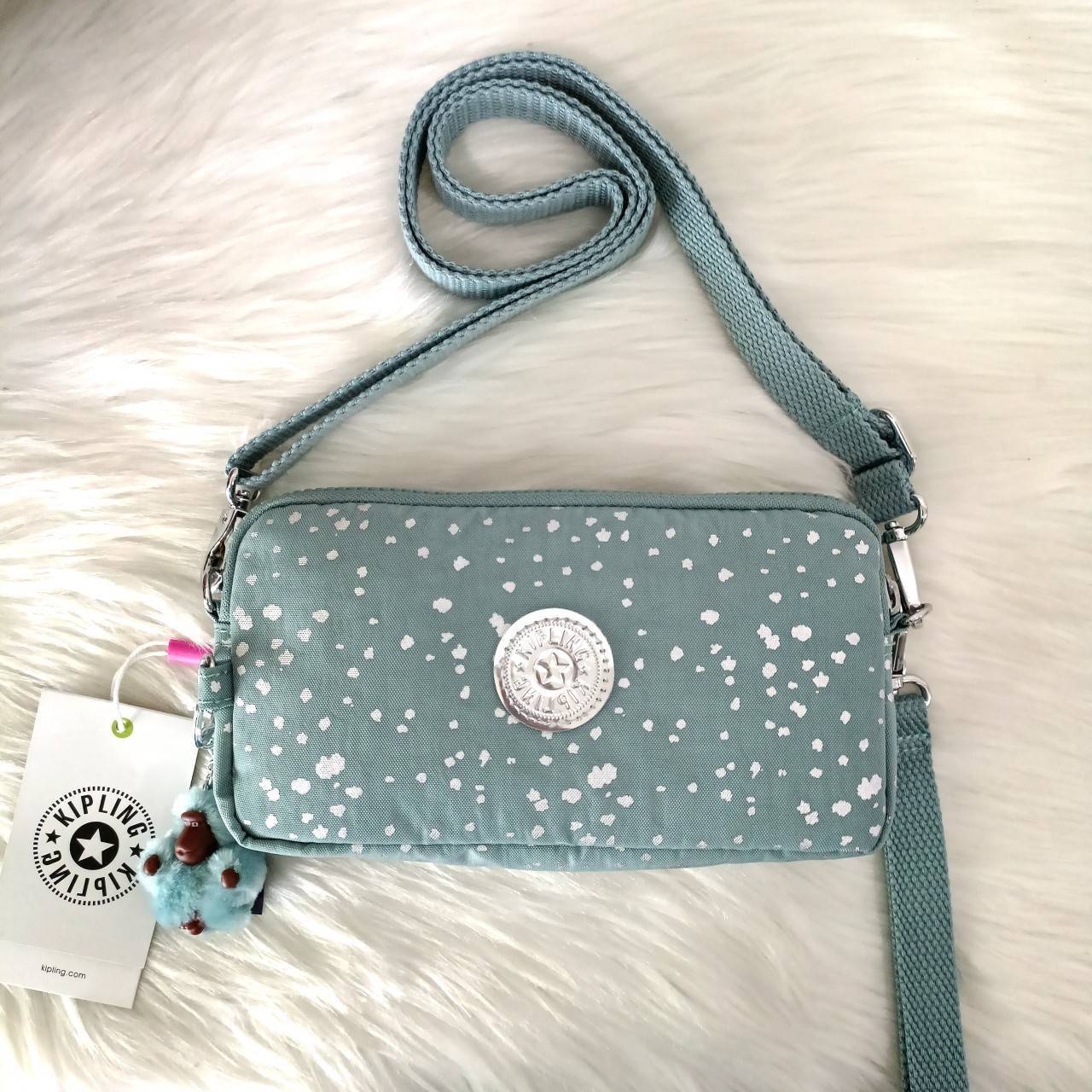 KIPLING กระเป๋าสตางค์ซิปรอบ ใบยาว Seoul up clutch & sling bag