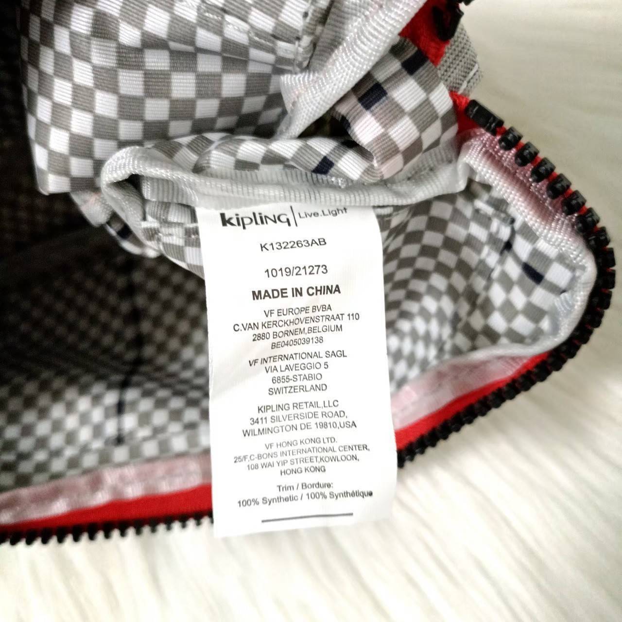 KIPLING กระเป๋าสตางค์ซิปรอบ ใบยาว Seoul up clutch & sling bag