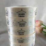 ป้ายคอเสื้อ เนื้อริบบิ้นซาติน 2.5 ซม. ริบบิ้นสีครีม s-2 พิมพ์ดำ 5 ม้วน