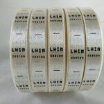 ป้ายคอเสื้อ เนื้อริบบิ้นซาติน 1.3 ซม. ริบบิ้นสีครีม S-2 พิมพ์ดำ 5 ม้วน