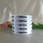 ป้ายคอเสื้อ เนื้อริบบิ้นซาติน 1.3 ซม. ริบบิ้นสีขาว 1 พิมพ์ดำ 5 ม้วน