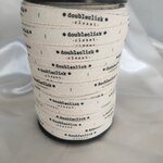 ป้ายคอเสื้อ เนื้อคอตต้อนก้างปลา 1.3 ซม.พิมพ์ดำ 1 ม้วน