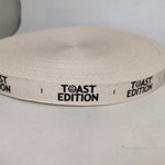 ป้ายคอเสื้อ เนื้อคอตต้อนก้างปลา 2.0 ซม.พิมพ์ดำ 1 ม้วน