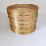 ป้ายคอเสื้อ เนื้อริบบิ้นซาติน 1.3 ซม. ริบบิ้นสีทอง 103 พิมพ์ดำ 5 ม้วน