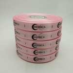 ป้ายคอเสื้อ เนื้อริบบิ้นซาติน 1.3 ซม. ริบบิ้นสีชมพู 64a พิมพ์ดำ 5 ม้วน