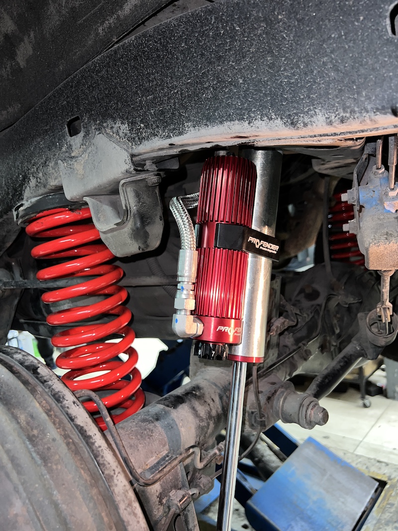 Fortuner Champ ติดตั้งชุดโช้คอัพ Profender ชุดท็อป พร้อมสปริง YSS Performance สิ่งที่จะได้รับหลังจากติดตั้ง: คู่หน้า Queen Series (ปรับ 16 ระดับ): เน้นความ นุ่มนวลสูงสุด ขับสบายสไตล์รถครอบครัว ปรับฟีลลิ่งได้ละเอียด คู่หลัง Piggyback (ปรับ 8 ระดับ): เพิ่มความ หนึบแน่น และ การทรงตัว ที่ยอดเยี่ยม ด้วยซับแทงก์ช่วยระบายความร้อน ทำให้สมรรถนะคงที่แม้เดินทางไกล สปริง YSS Performance: ออกแบบมาเพื่อ บาลานซ์น้ำหนัก และทำงานร่วมกับโช้คอัพได้อย่างสมบูรณ์แบบ ฟีลลิ่งที่ได้: หนึบนวล ลงตัว รถไม่โคลงเคลง เข้าโค้งมั่นใจ ผู้โดยสารนั่งสบาย เหมาะสำหรับใคร? เจ้าของ Fortuner ที่ใช้งานหลากหลาย ทั้งในเมืองและเดินทางไกล ผู้ที่ต้องการ ช่วงล่างที่สามารถปรับจูนได้ละเอียด เพื่อหาจุดที่ลงตัวที่สุดสำหรับรถของตัวเอง  ยกระดับรถคุณให้เหนือกว่าใคร ด้วยบริการติดตั้งชุดใหญ่จาก #ยางเจริญรุ่งเรือง  สอบถามข้อมูลเพิ่มเติม หรือนัดหมายเข้ารับบริการ ️ : 08-6569-1915 ️ : 08-6544-5963  Line id : @88rw  Location : https://goo.gl/maps/HrNUAZXPN94KvxZ98  Facebook : https://www.facebook.com/88rwtire #Toyota #Fortuner #Profender #QueenSeries #Piggyback #YSS #โช้คอัพ #ช่วงล่าง #ยางเจริญรุ่งเรือง #นนทบุรี #งามวงศ์วาน